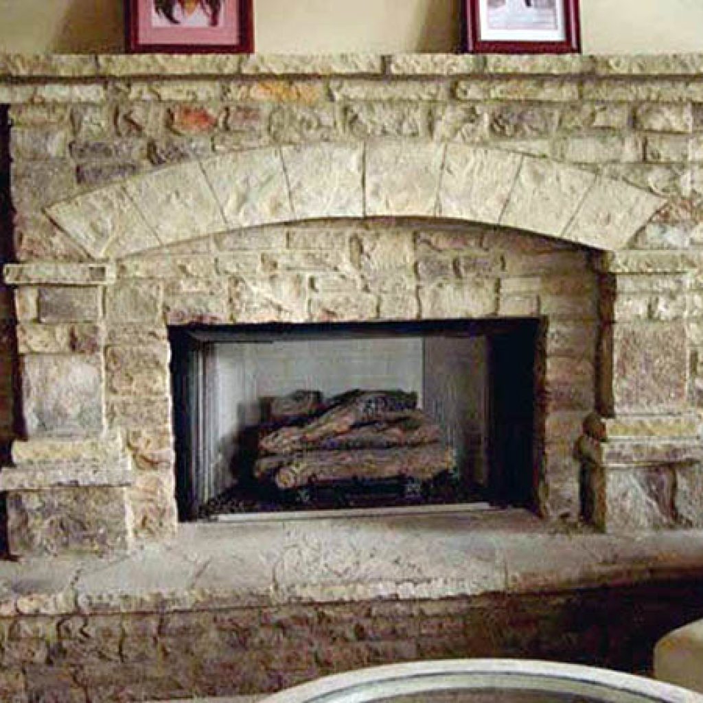 A close-up shot of the fireplace and arch in natural stone