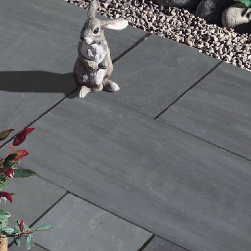 A rabbit figurine standing on the natural stone flooring