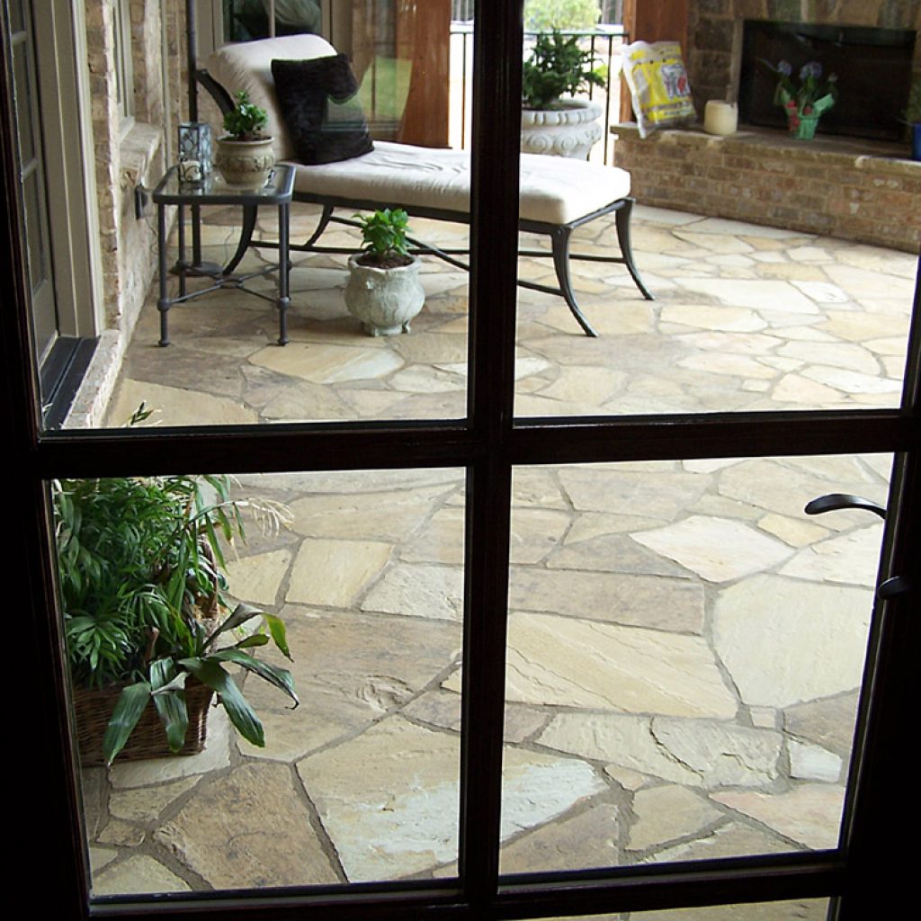 A picture of the dark thick flagstone flooring inside the house