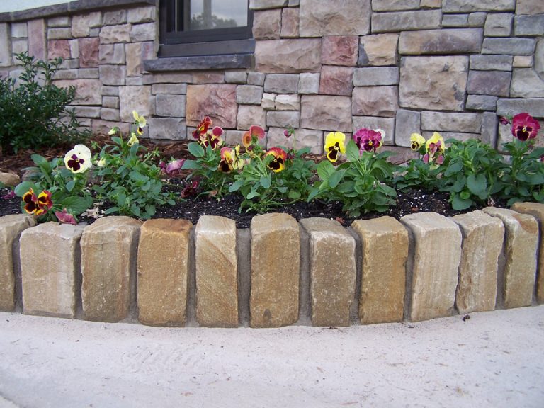Tumbled cobbles used as edging of a flower bed