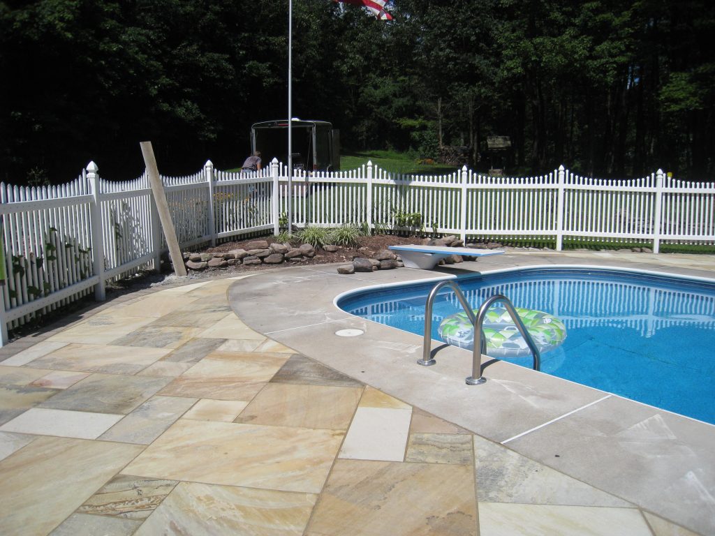 Mint Fossil Granite stone around the pool
